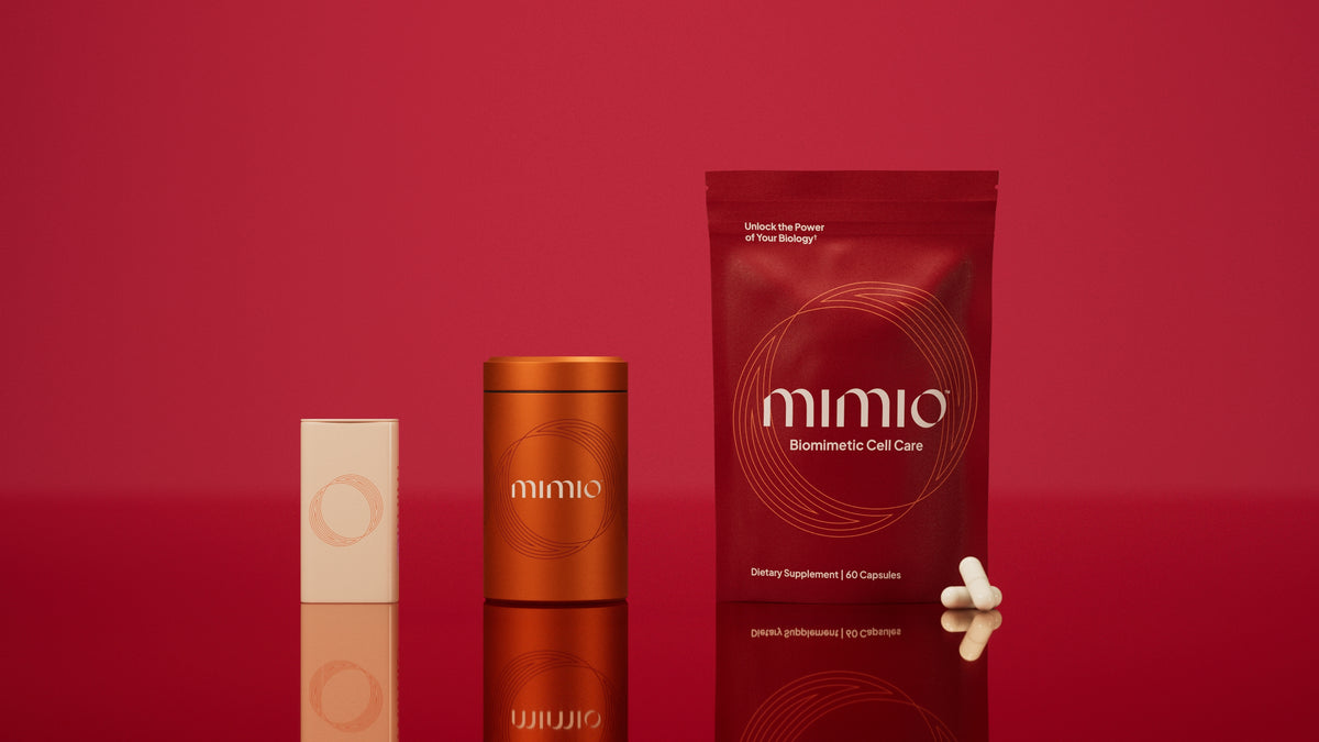 Mimio Biomimetic Cell Care pouch and branded packaging on a red background